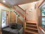 The staircase leads to upstairs bedrooms